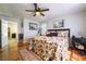 Spacious bedroom with hardwood floors, an artwork, and a view to the doorway at 632 Monument Point St, Henderson, NV 89002