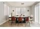 The dining room features wood-look tile flooring and large windows, creating a bright and inviting space at 632 Monument Point St, Henderson, NV 89002