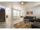 Bright living room with stylish tile floors and a seamless flow into the dining area at 632 Monument Point St, Henderson, NV 89002