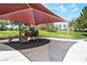 Community playground featuring modern equipment and a sunshade at 632 Monument Point St, Henderson, NV 89002