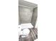 Modern bathroom with tiled shower, updated fixtures, and wood-look flooring at 708 Fernwood Ln, Las Vegas, NV 89169