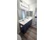 This modern bathroom features double sinks, cabinets, and modern fixtures at 708 Fernwood Ln, Las Vegas, NV 89169