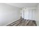 This bedroom features modern laminate flooring, neutral walls, and a closet for ample storage at 708 Fernwood Ln, Las Vegas, NV 89169