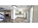 Open concept living area with a fireplace and sliding glass doors to the outside at 708 Fernwood Ln, Las Vegas, NV 89169