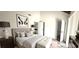 Calming main bedroom featuring neutral tones, soft textures, and an ensuite bathroom for added comfort at 708 Fernwood Ln, Las Vegas, NV 89169