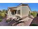 Charming home with a covered patio, lush landscaping, and a peaceful backyard oasis at 7331 Abundant Harvest Ave, Las Vegas, NV 89131