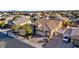 A house with a brick driveway, three-car garage, solar panels, and manicured landscaping at 7331 Abundant Harvest Ave, Las Vegas, NV 89131