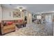 Inviting living room with stylish furniture, decorative wall art, and large windows for ample light at 7331 Abundant Harvest Ave, Las Vegas, NV 89131