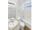 Bright bathroom with a tub, shower, tile surround, and modern fixtures at 7524 Fencerow St, Las Vegas, NV 89131