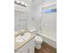 Clean bathroom with laminate floors, single sink vanity, and a shower-tub combination at 7524 Fencerow St, Las Vegas, NV 89131