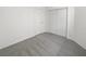 Carpeted bedroom featuring white walls, a closet, and a door at 7524 Fencerow St, Las Vegas, NV 89131