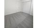 Carpeted bedroom featuring white walls, a closet, and a door at 7524 Fencerow St, Las Vegas, NV 89131
