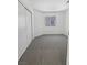 Bright bedroom featuring neutral carpet, white walls, a window, and closet space at 7524 Fencerow St, Las Vegas, NV 89131