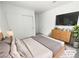 Virtually staged bedroom featuring a sleek closet and a contemporary dresser at 7524 Fencerow St, Las Vegas, NV 89131