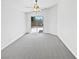Bright bedroom offering new carpet, ceiling fan, and access to the backyard at 7524 Fencerow St, Las Vegas, NV 89131