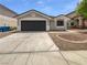 Charming single-story home featuring a two-car garage and low maintenance landscaping at 7524 Fencerow St, Las Vegas, NV 89131