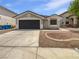 Charming single-story home featuring a two-car garage and low-maintenance landscaping at 7524 Fencerow St, Las Vegas, NV 89131