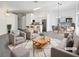 Bright, virtually staged living room featuring an open floor plan and modern decor at 7524 Fencerow St, Las Vegas, NV 89131