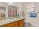Bathroom with a granite countertop vanity and adjacent toilet at 7544 Shangri La Ave, Las Vegas, NV 89147