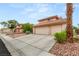 Charming two-story home featuring a three-car garage and a well-maintained, landscaped front yard at 7544 Shangri La Ave, Las Vegas, NV 89147