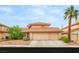 Charming two-story home featuring a three-car garage and a well-maintained, landscaped front yard at 7544 Shangri La Ave, Las Vegas, NV 89147