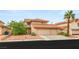 Charming two-story home featuring a three-car garage and a well-maintained, landscaped front yard at 7544 Shangri La Ave, Las Vegas, NV 89147