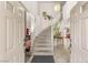 Grand foyer featuring a staircase, chandelier, and bright natural light, creating an inviting entrance at 7544 Shangri La Ave, Las Vegas, NV 89147