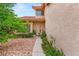 Inviting front entrance showcasing well-manicured landscaping and a charming walkway to the front door at 7544 Shangri La Ave, Las Vegas, NV 89147