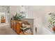 Hallway featuring a built-in cabinet, plants, and staircase at 7544 Shangri La Ave, Las Vegas, NV 89147