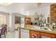 Open layout: kitchen with granite countertops overlooking the living area and backyard at 7544 Shangri La Ave, Las Vegas, NV 89147
