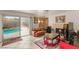 Bright living room with pool access and fireplace at 7544 Shangri La Ave, Las Vegas, NV 89147