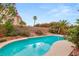 Backyard swimming pool surrounded by lush landscaping and palm trees at 7544 Shangri La Ave, Las Vegas, NV 89147