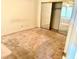 Bedroom featuring a mirrored closet and a ceiling fan at 7570 W Flamingo Rd # 202, Las Vegas, NV 89147