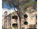 Charming exterior of a multi-unit home featuring desert landscaping and a private balcony at 7570 W Flamingo Rd # 202, Las Vegas, NV 89147