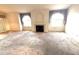 Open-concept living room features a fireplace and lots of natural light at 7570 W Flamingo Rd # 202, Las Vegas, NV 89147