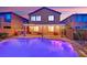 Private backyard featuring a pool, covered patio, stainless steel grill, and landscaped area at 765 Crimson Peak Pl, Henderson, NV 89011