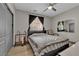 Bedroom boasts a ceiling fan, guitars, bright windows, and ample closet space at 765 Crimson Peak Pl, Henderson, NV 89011