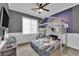 This bedroom features an eye-catching galaxy mural and is spacious at 765 Crimson Peak Pl, Henderson, NV 89011