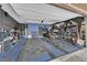 Spacious garage with a tiled floor, ample storage, and organized shelving, perfect for parking and projects at 765 Crimson Peak Pl, Henderson, NV 89011
