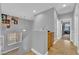 Upstairs hallway with gray walls and tile floors at 765 Crimson Peak Pl, Henderson, NV 89011