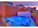 Close-up of a luxurious backyard hot tub with jets and built-in features at 765 Crimson Peak Pl, Henderson, NV 89011