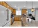Modern kitchen with granite countertops, stainless steel appliances, and a spacious island at 765 Crimson Peak Pl, Henderson, NV 89011