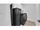Laundry room features a front-load washer and dryer with overhead cabinets at 765 Crimson Peak Pl, Henderson, NV 89011