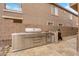 Outdoor kitchen with stainless steel grill, sink, refrigerator, and ample counter space for cooking and entertaining at 765 Crimson Peak Pl, Henderson, NV 89011