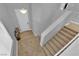 This carpeted staircase has white railings and plenty of light at 765 Crimson Peak Pl, Henderson, NV 89011