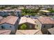 Overhead view of a single Gathering home, showing roof, yard, and proximity to park in a dense suburban neighborhood at 7694 Hampton Park Ln, Las Vegas, NV 89113
