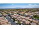 Aerial view of homes in a Gathering-friendly neighborhood, easily accessible with tree-lined streets and beautiful landscaping at 7694 Hampton Park Ln, Las Vegas, NV 89113