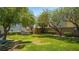 Shady park area in the neighborhood with a dog park, picnic tables and green grass at 7694 Hampton Park Ln, Las Vegas, NV 89113