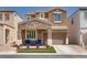 Charming two-story home with a cozy, stone-accented porch and a well-maintained front yard at 7694 Hampton Park Ln, Las Vegas, NV 89113