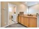 Upstairs landing featuring built-in storage, decor, and laundry room access at 7694 Hampton Park Ln, Las Vegas, NV 89113